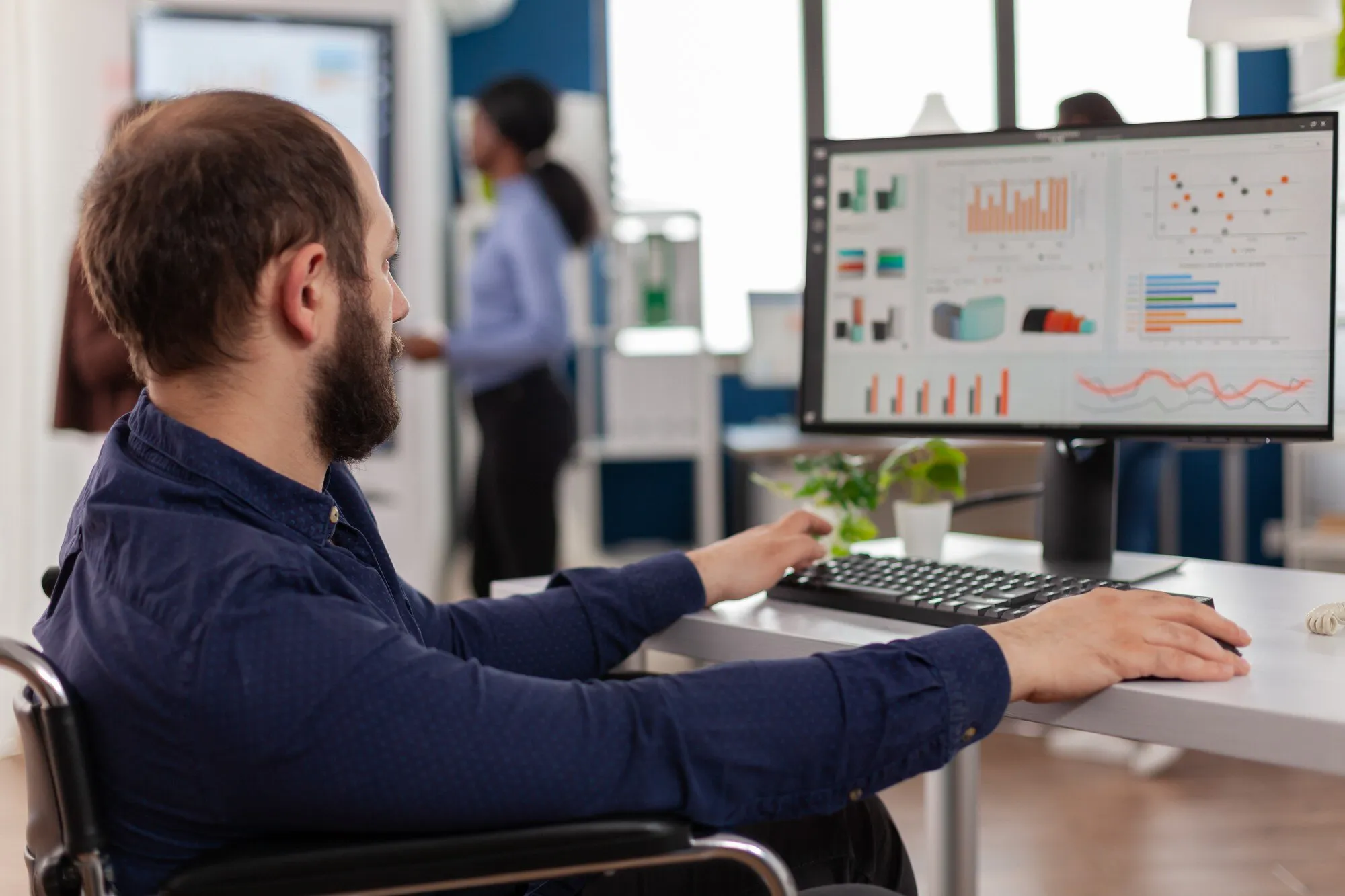 imgi_10_invalid-worker-with-disabilities-working-computer_482257-21593